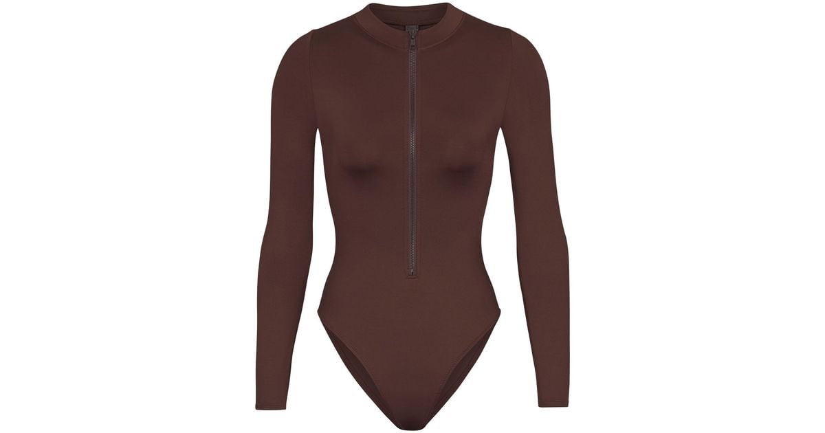 Skims Swim Zip Front Long Sleeve One Piece in Cocoa (Brown) Lyst