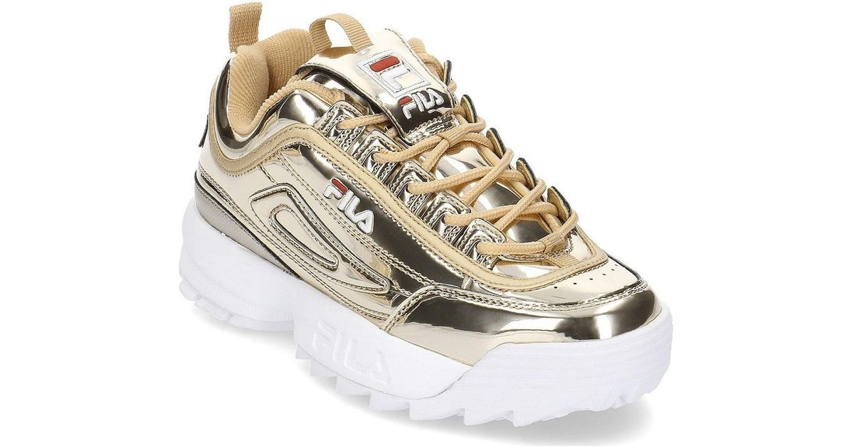 gold fila trainers