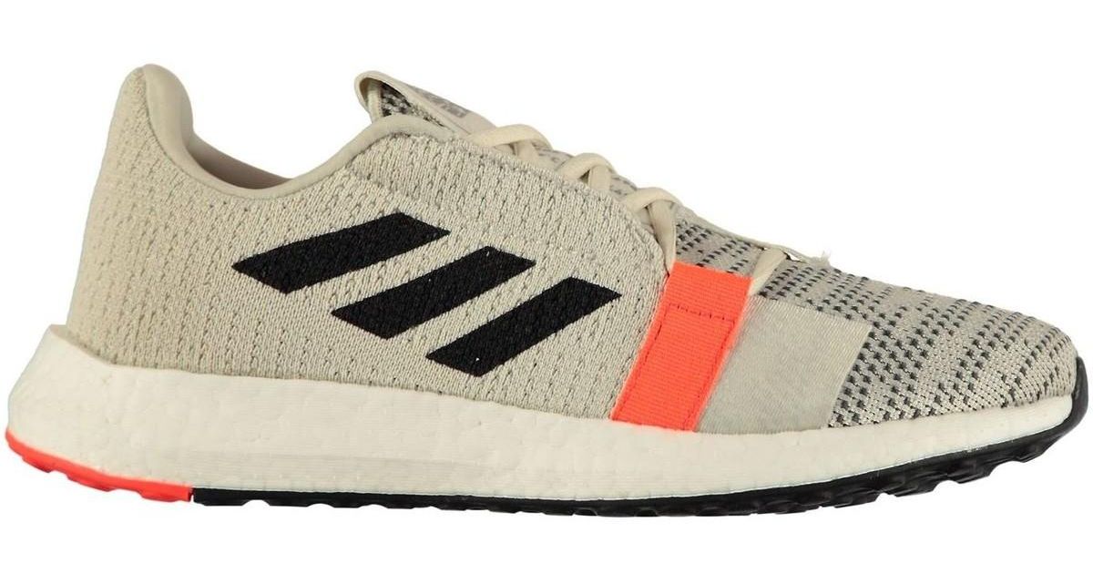 beige running trainers