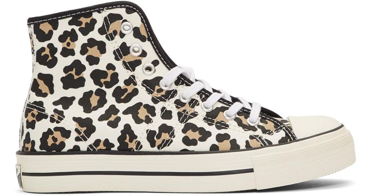 white converse with leopard print