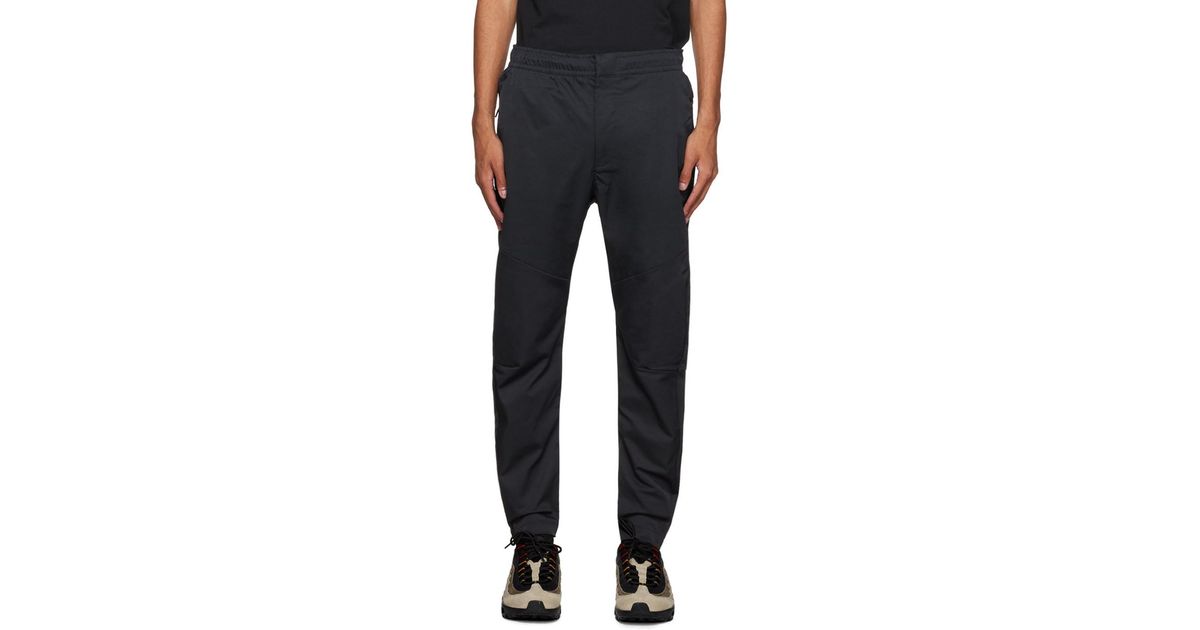 nike woven commuter trousers