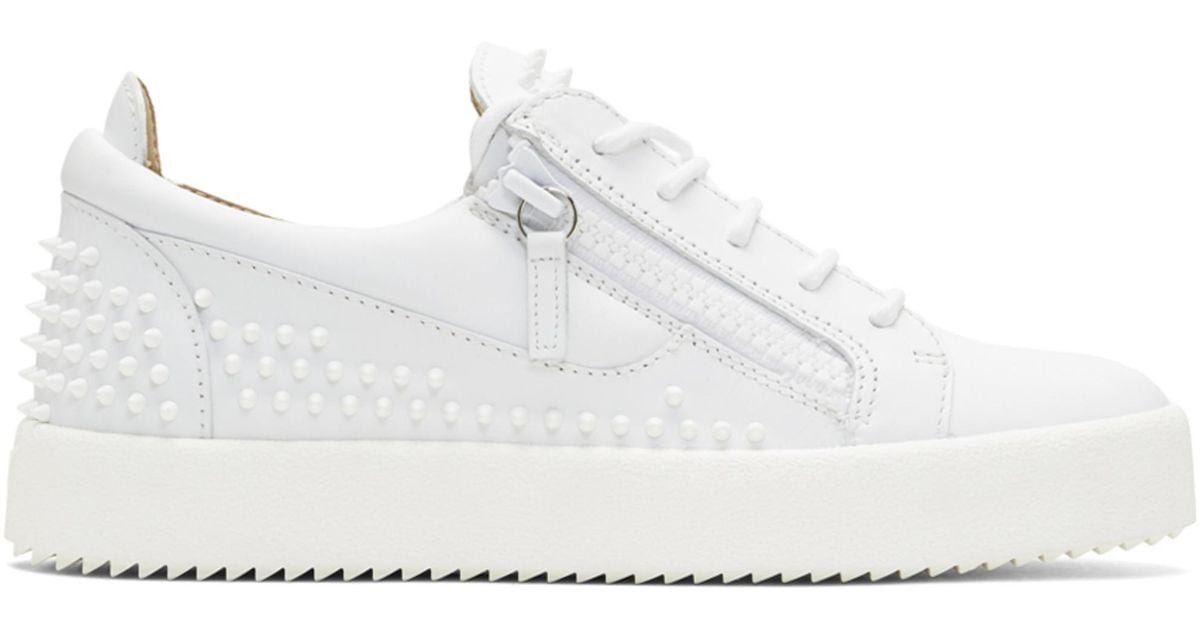 studded white trainers