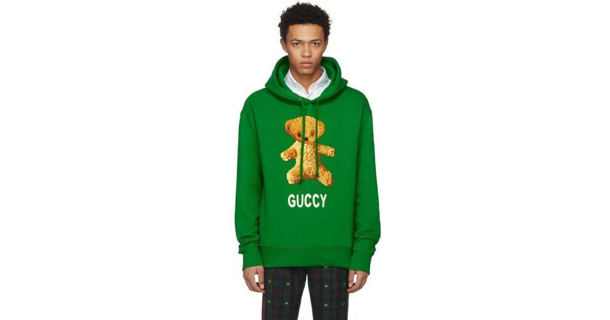 pink gucci sweater with green bear