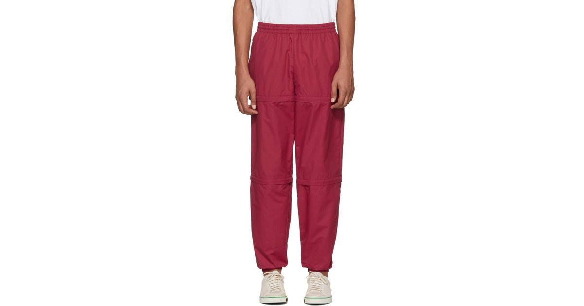 red nylon track pants