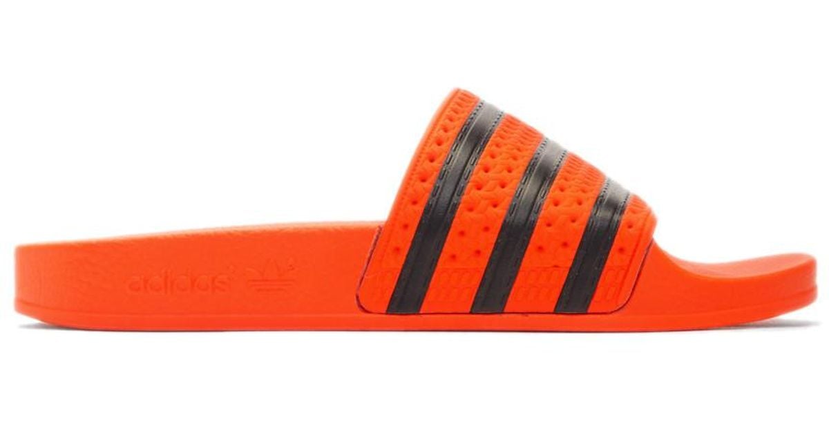 adilette slides orange
