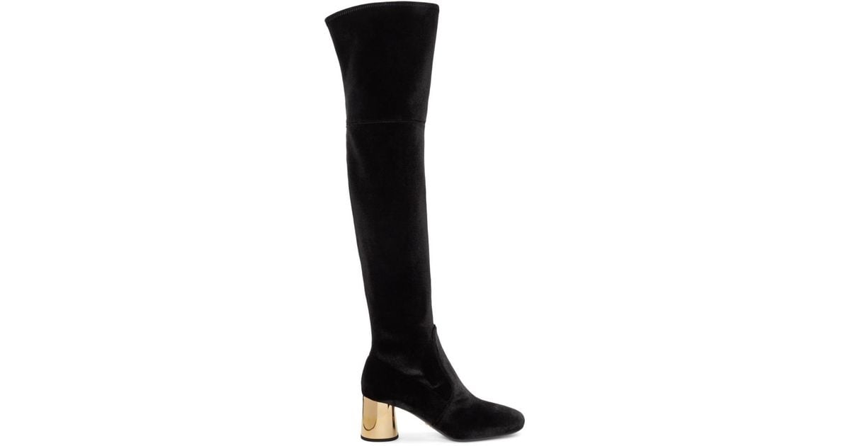 black and gold over the knee boots