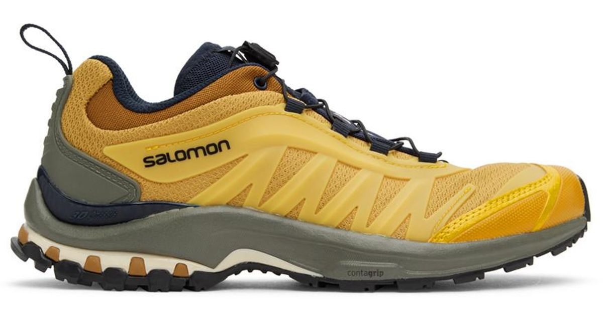 yellow salomon shoes