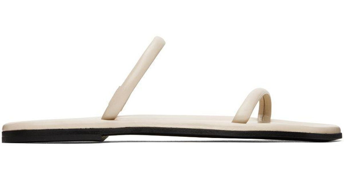 Totême Toteme Off-white 'the City Slide' Sandals in Black | Lyst