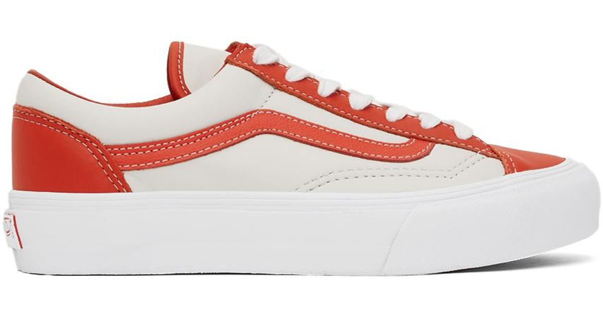 white vans with orange bottom