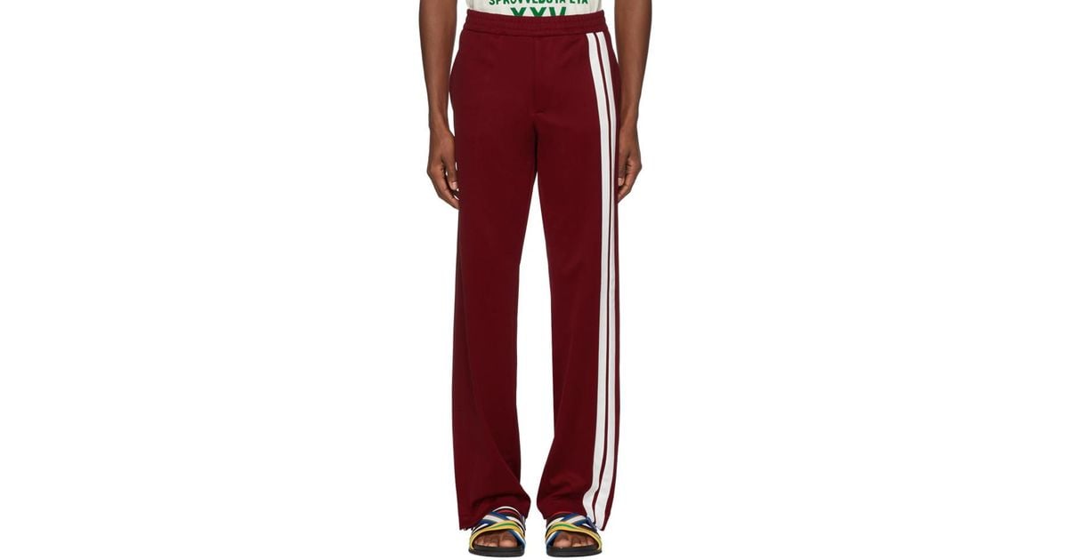 red sweatpants with white stripe