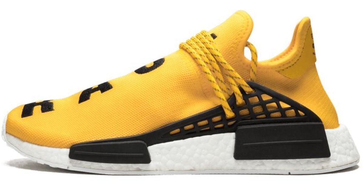 human race nmd black yellow