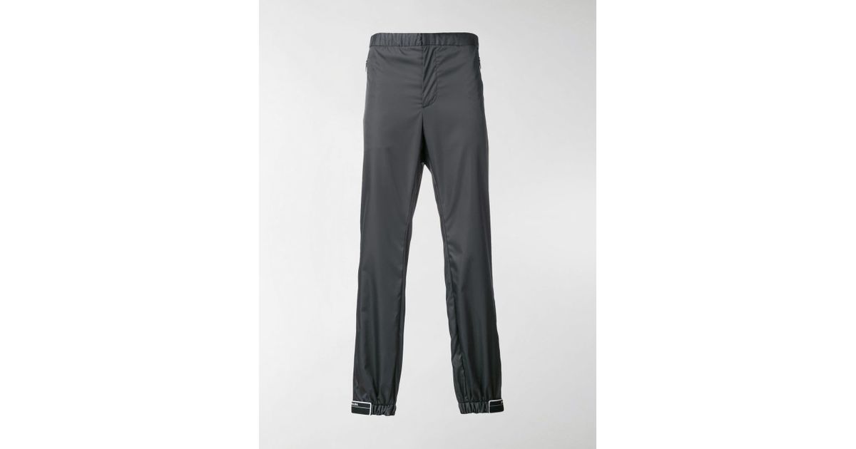 prada rubber tag track pants