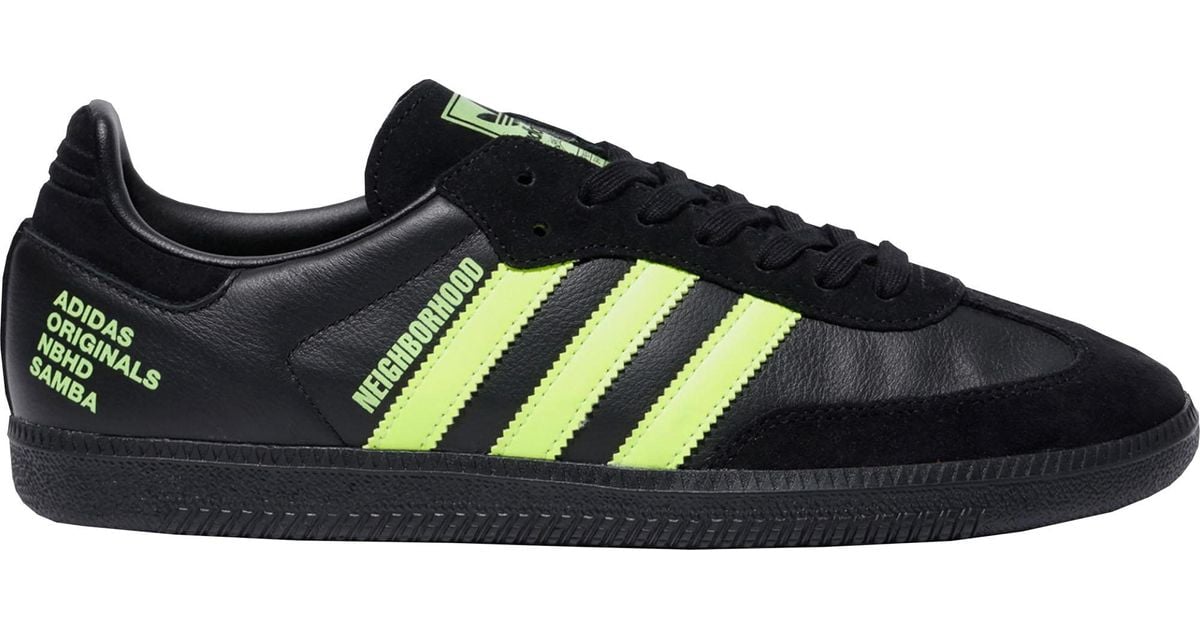 black and lime green adidas