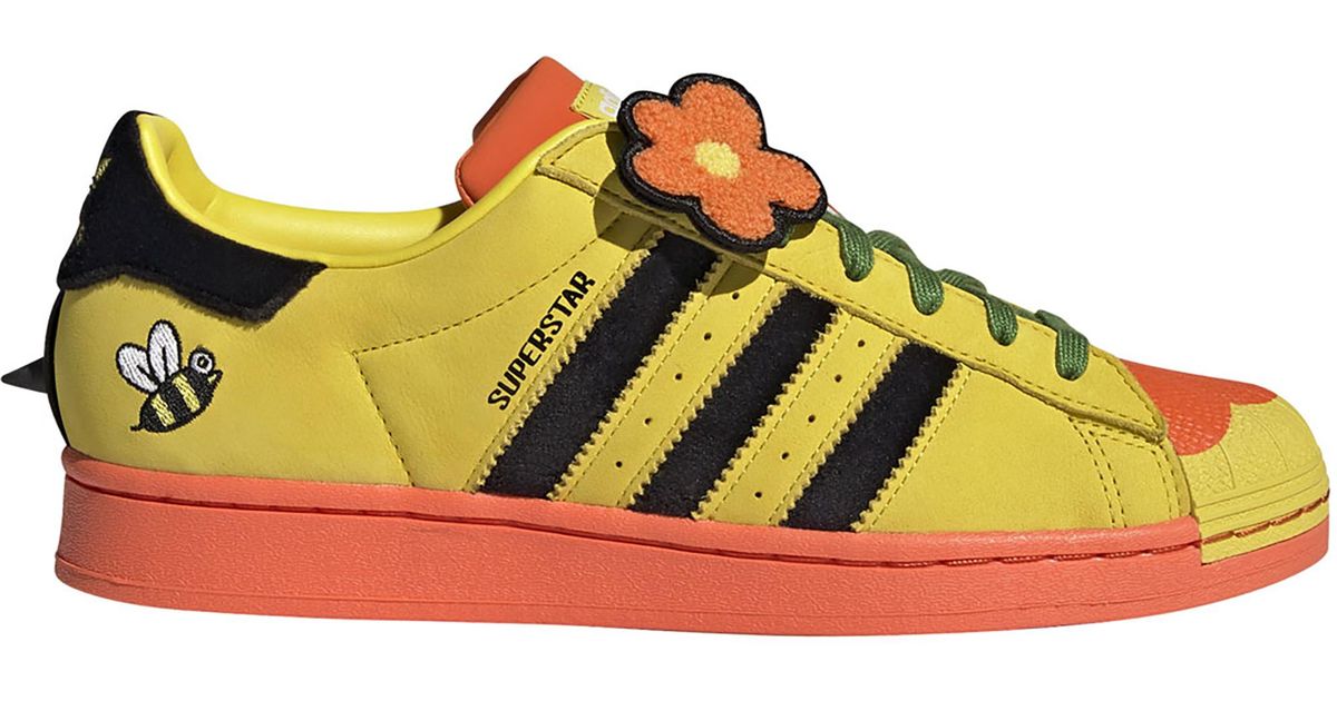 orange and yellow adidas