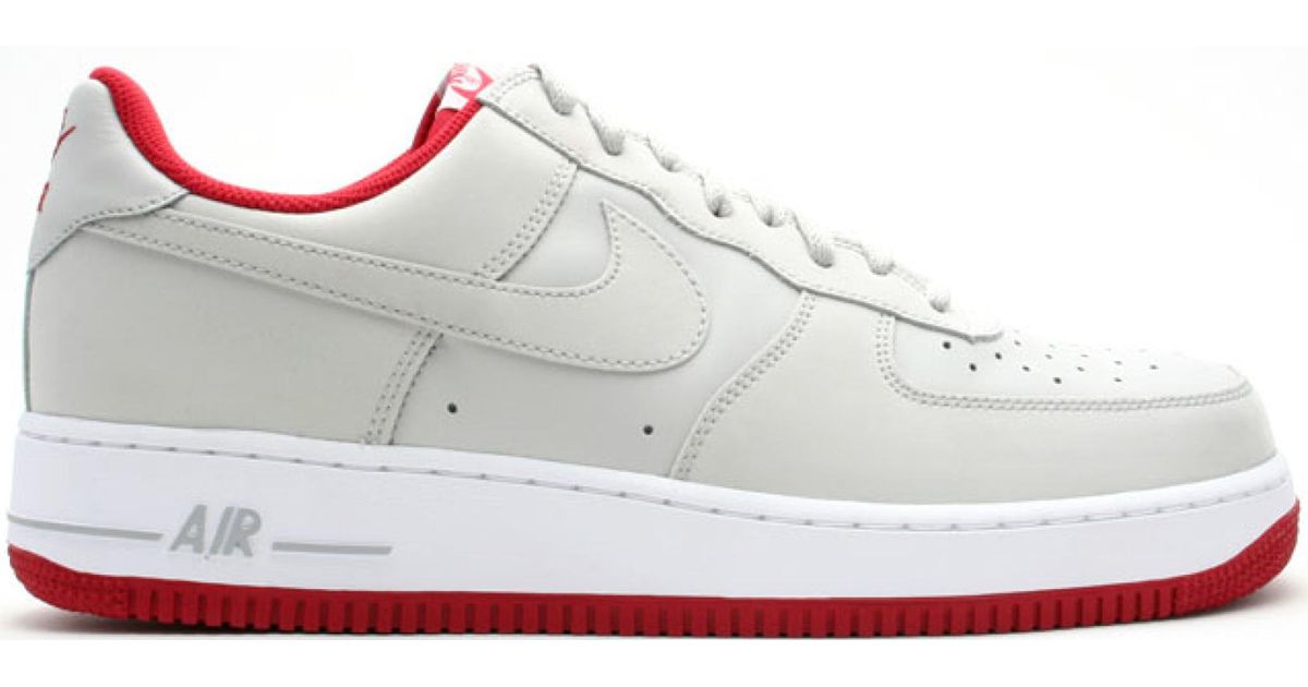gray and red air force 1