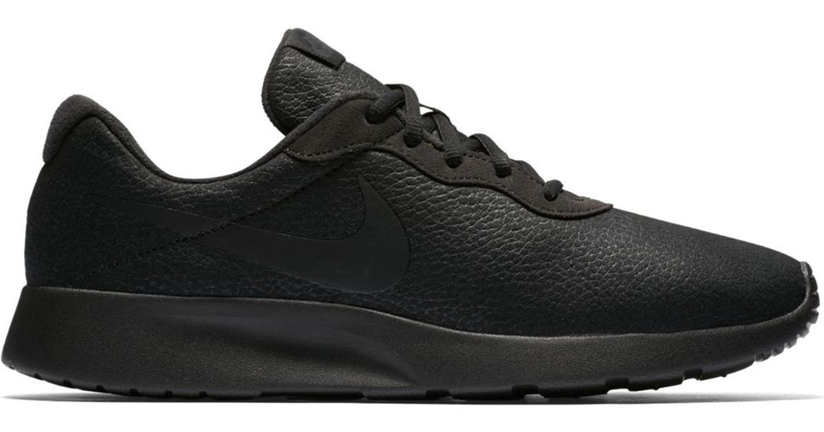 nike tanjun gold black