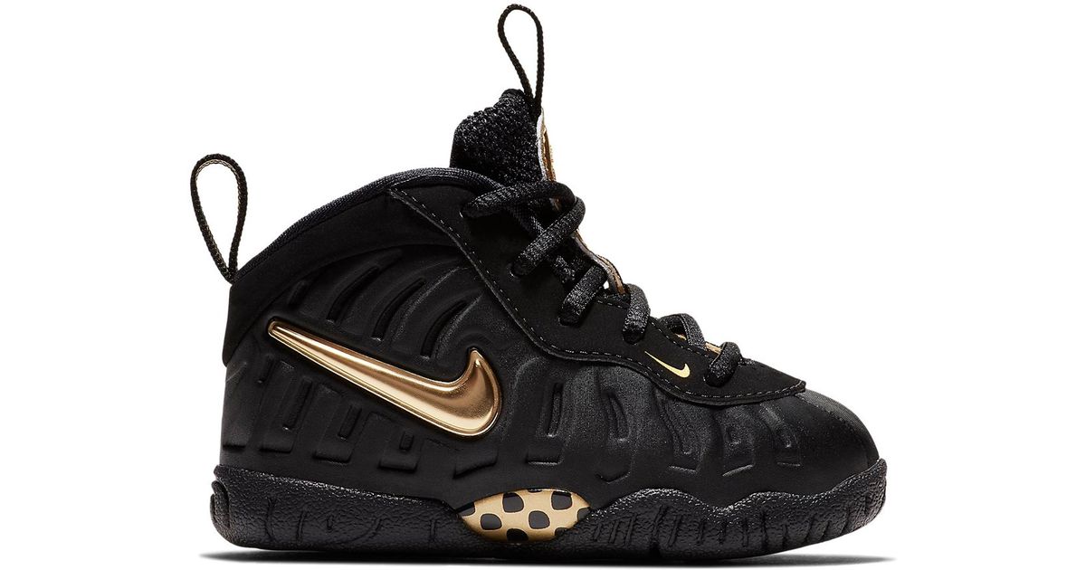 black and gold nike foams