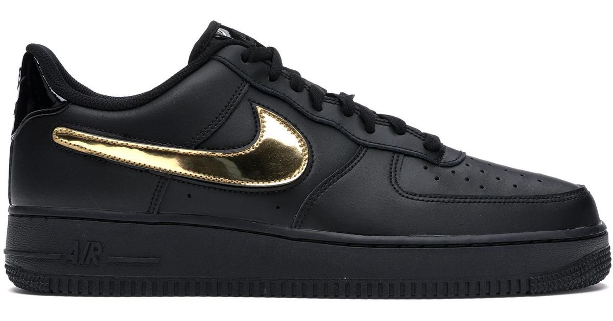 black nike with gold swoosh