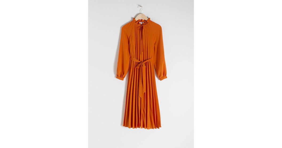 orange pleated midi dress