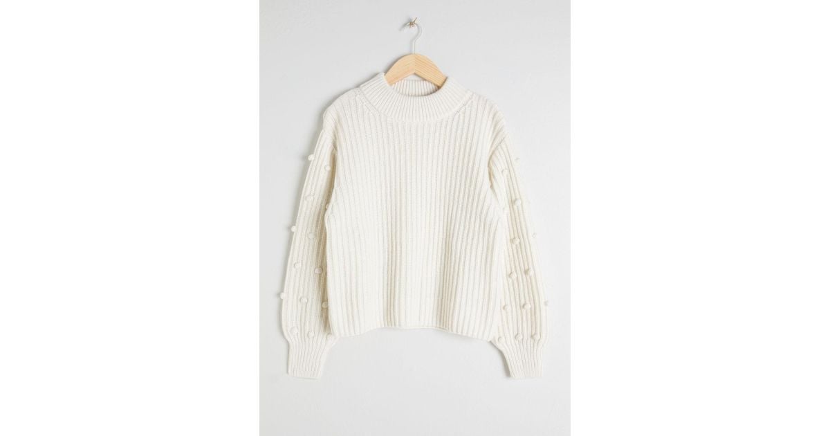 pom pom sleeve sweater