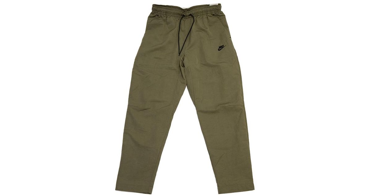 Nike Nsw Tech Essentials Lined Commuter Pants 'green' for Men | Lyst
