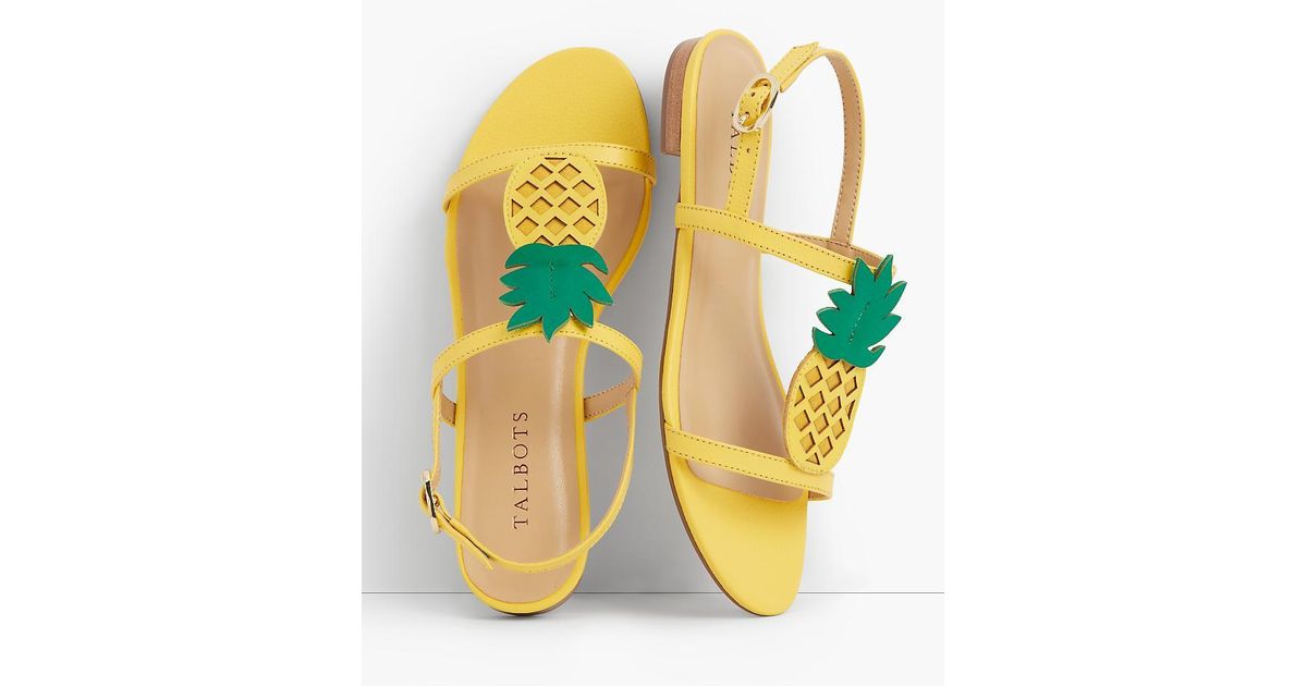 yellow box pineapple flip flops