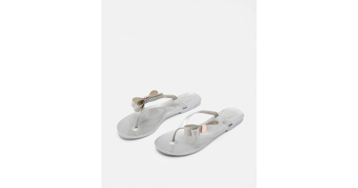 jelly flip flops with bow detail