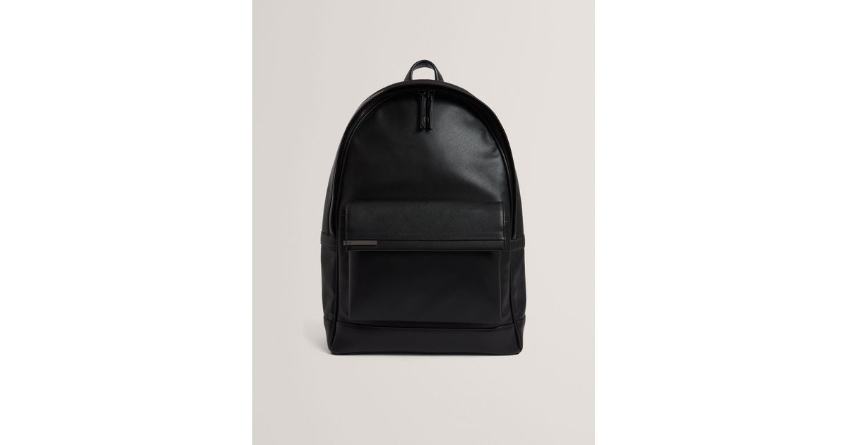 crosshatched leather backpack in brown it includes a front zipper pocket The RamblerPack Backpack blends durable