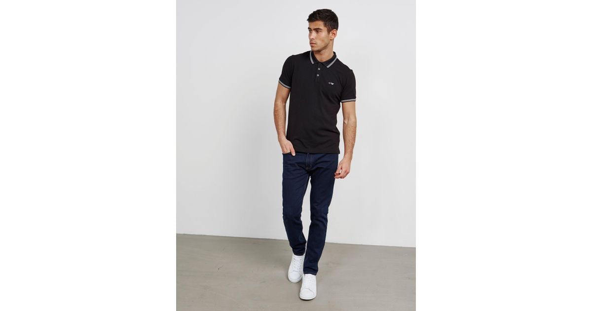 black jeans and polo shirt