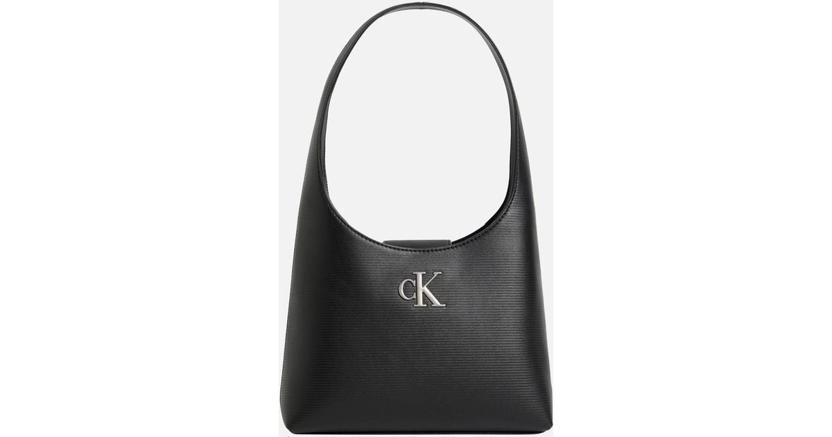 ★【CK JEANS】 Minimal Monogram Flap Shoulder Bag ★ Calvin Klein Jeans minimal monogram shoulder bag in black | ASOS
