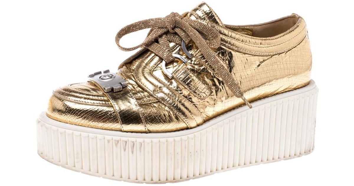 chanel gold sneakers