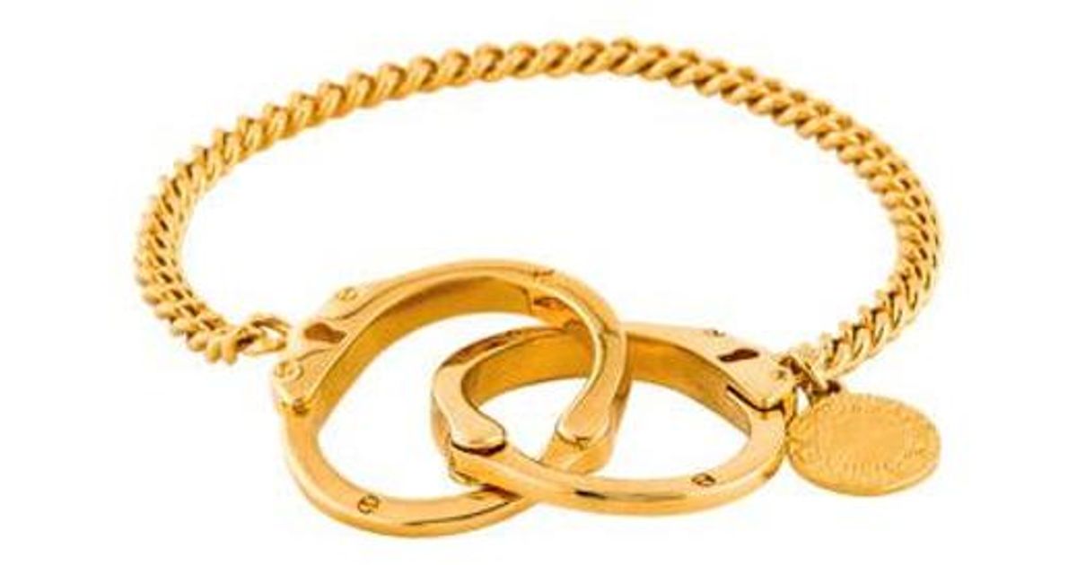 Lyst Stella Mccartney Handcuff Bracelet Gold In Metallic