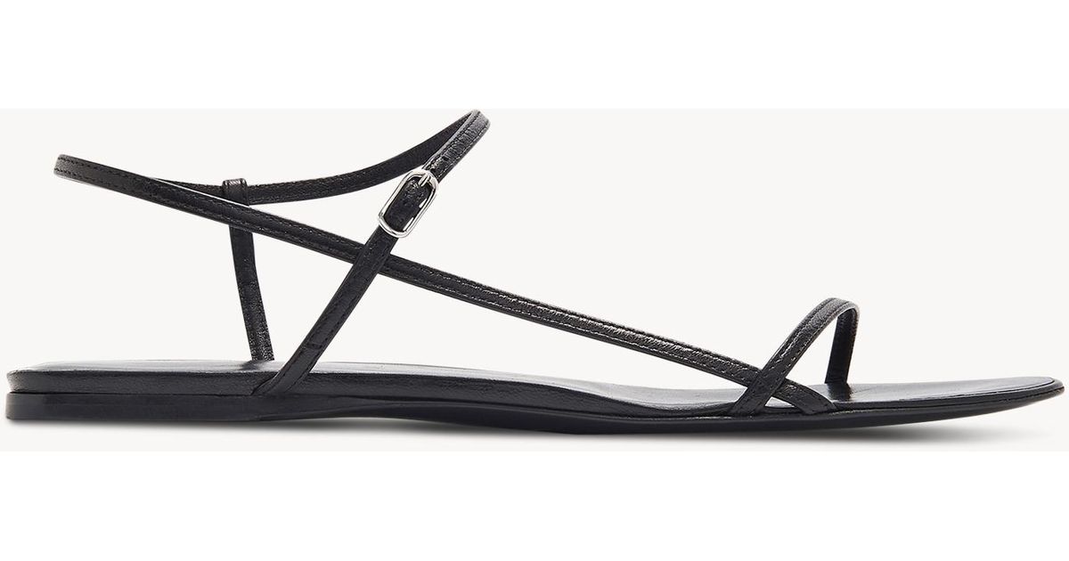 The Row Bare Flat Sandal In Leather in Black - Lyst