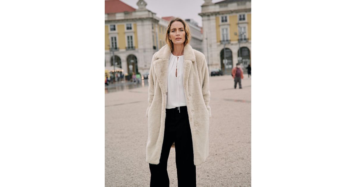 white company faux fur coat