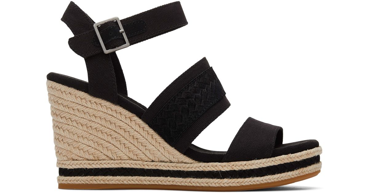 Sandale compensée madelyn à bride tressée noire en daim TOMS en coloris