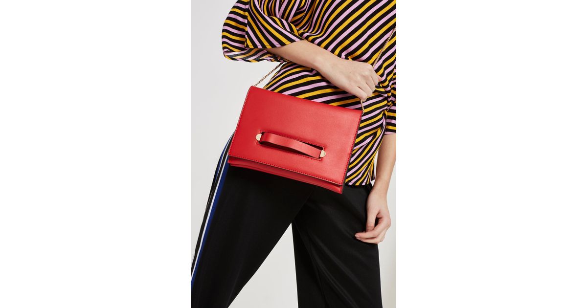 red clutch bag topshop