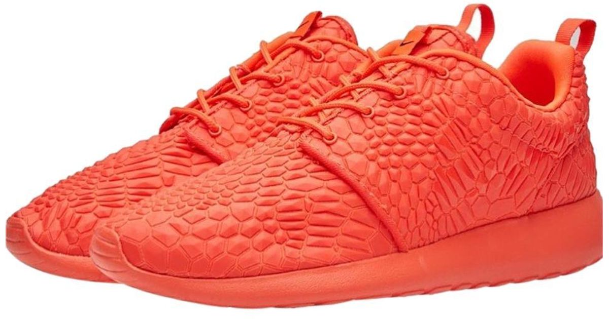 orange neon nike shoes