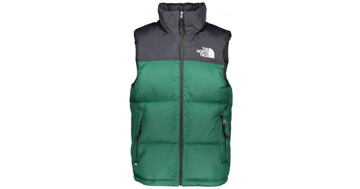 green north face puffer vest