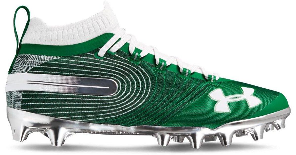 green and white under armour football cleats