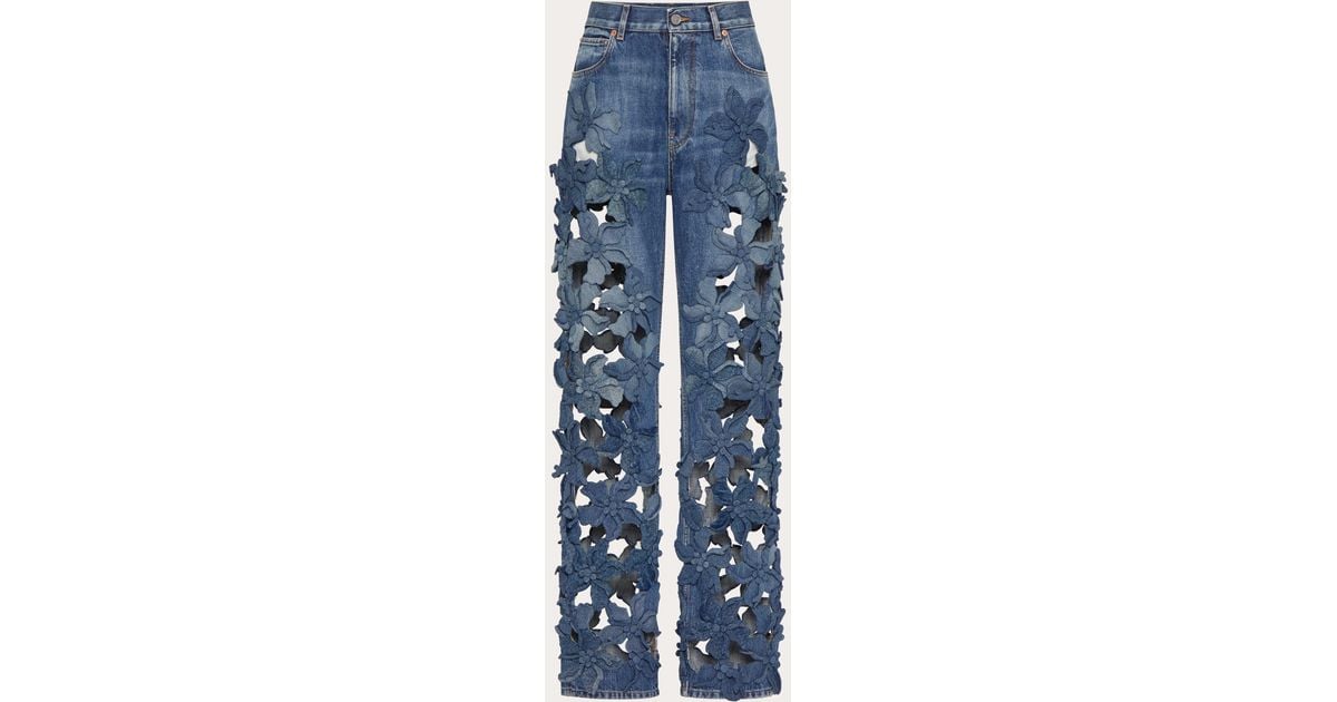 ボトムスその他 Valentino Washed blue jeans with floral fabric trims Valentino Washed blue jeans with floral fabric trims