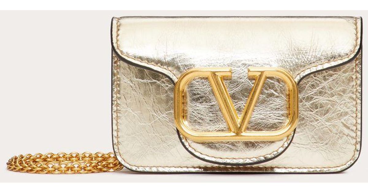 Valentino Garavani Micro Bag With Locò Chain In Metallic Calfskin in  Natural