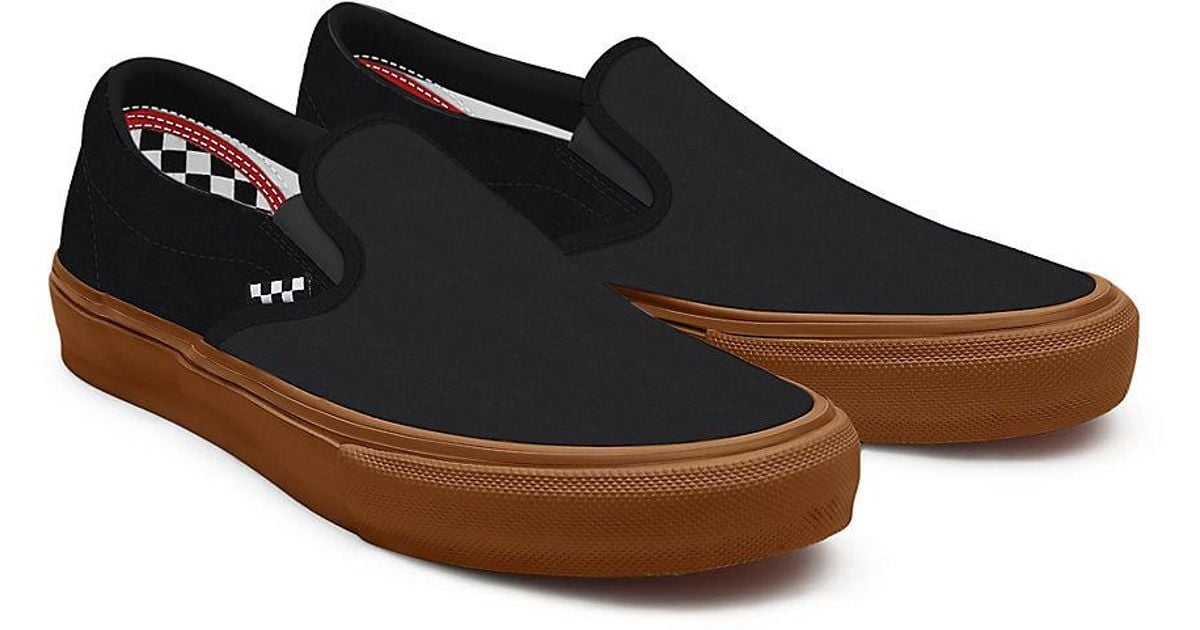 Vans black sole slip hotsell on