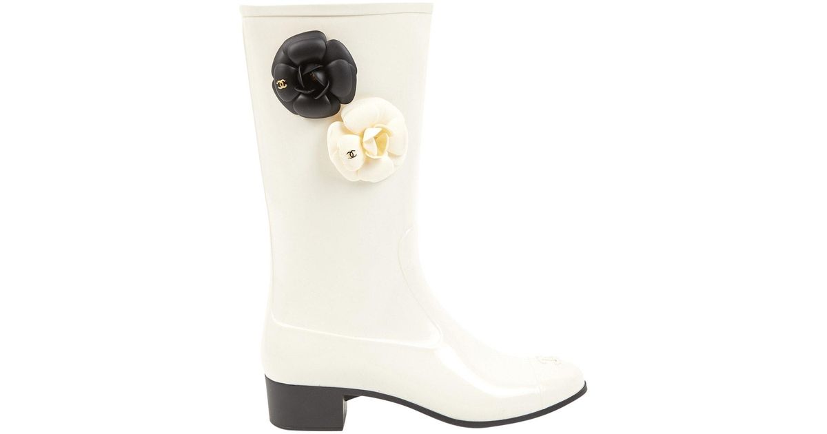 white plastic boots
