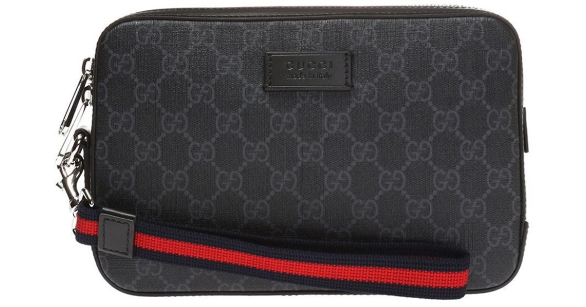 gucci supreme clutch bag