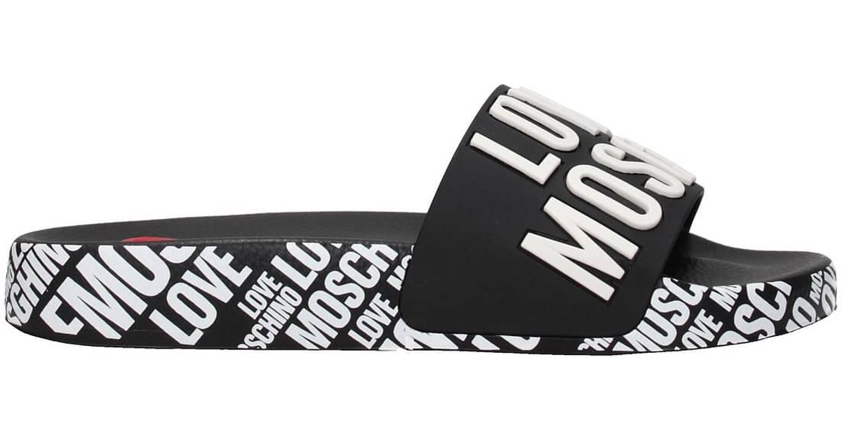 Love Moschino Slippers And Clogs Pvc White | Lyst