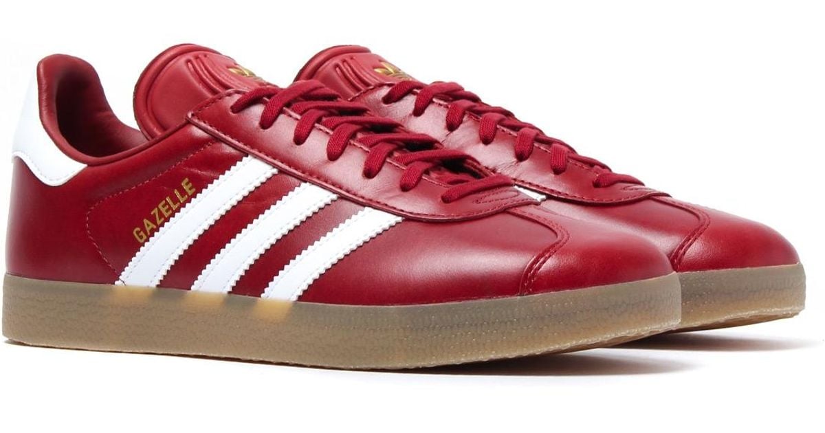 red leather adidas trainers