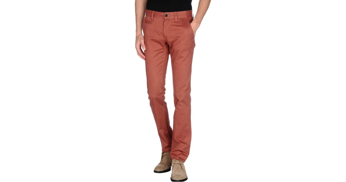 brick red trousers