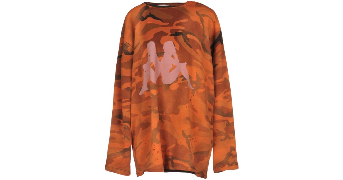 white and orange kappa shirt