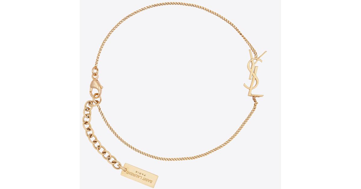 Authentic YSL logo Yves Saint Laurent gold bracelet. Gold plated - Women's  accessories