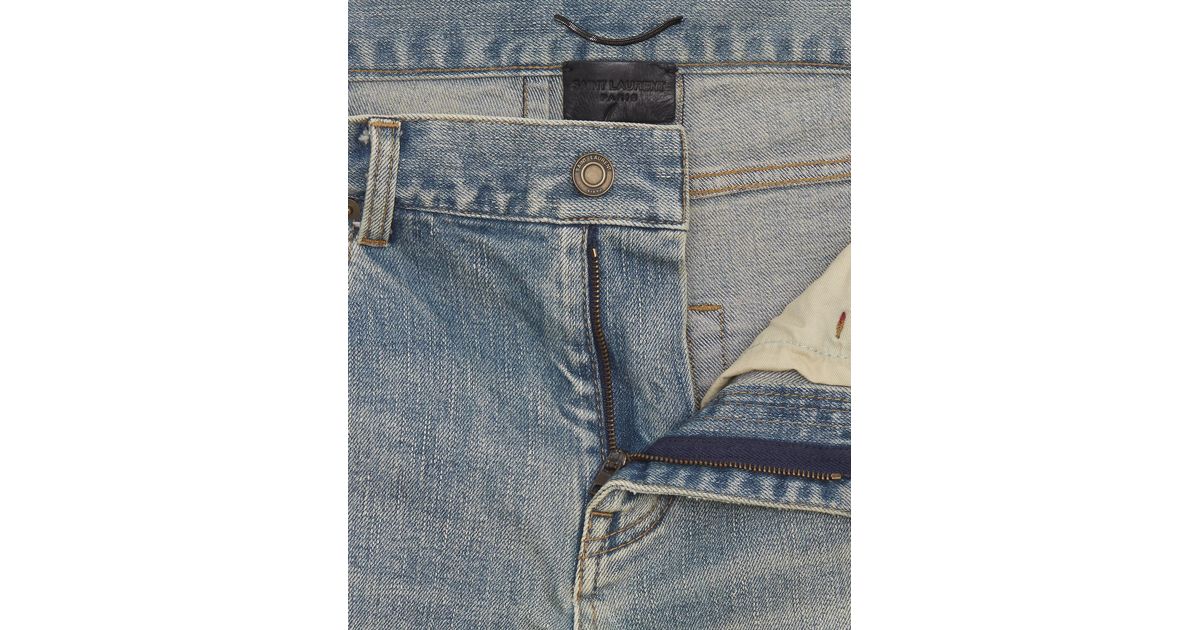 original low waisted destroyed skinny jean in dirty original blue trash denim